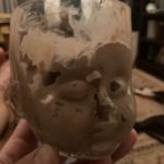 Baby Head Cup filled with chocolate ice cream