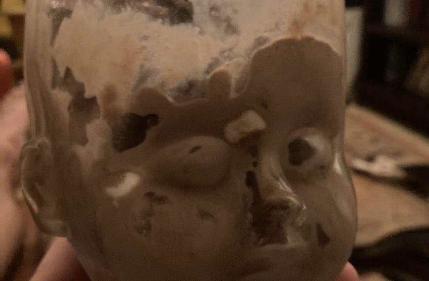 Baby Head Cup filled with chocolate ice cream