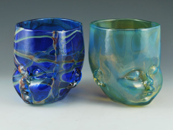 One "Nebula" and one "Fabula" Glass Baby Head Cup