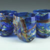 Three "Fabula" Glass Baby Head Cupss