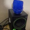 Blue Baby Head Cup on top of a speaker