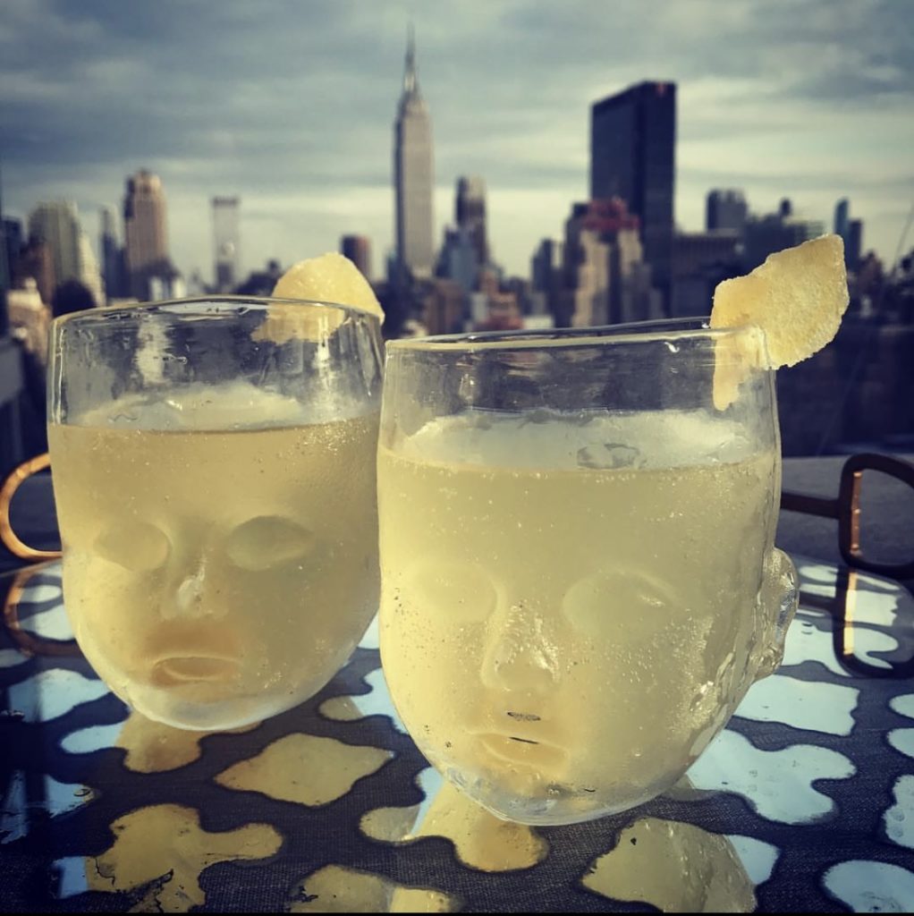 Baby Head Cups filled with cocktails on a rooftop in the city