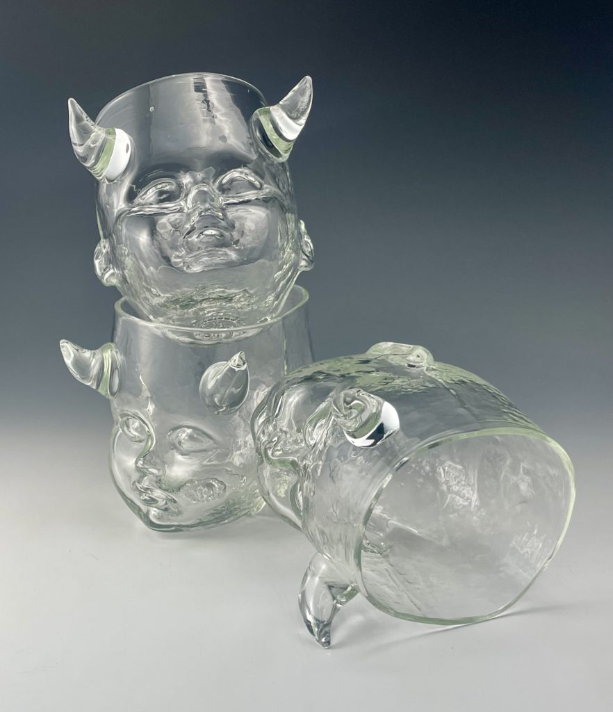 Three Horned Baby Head Cups stacked one on top of the other.