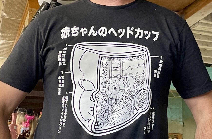 Baby Head Cup Mechanism T-Shirt worn by a man.