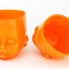 Two Orange Glass Baby Head Cups by Oliver Doriss