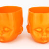 Two Orange Glass Baby Head Cups by Oliver Doriss