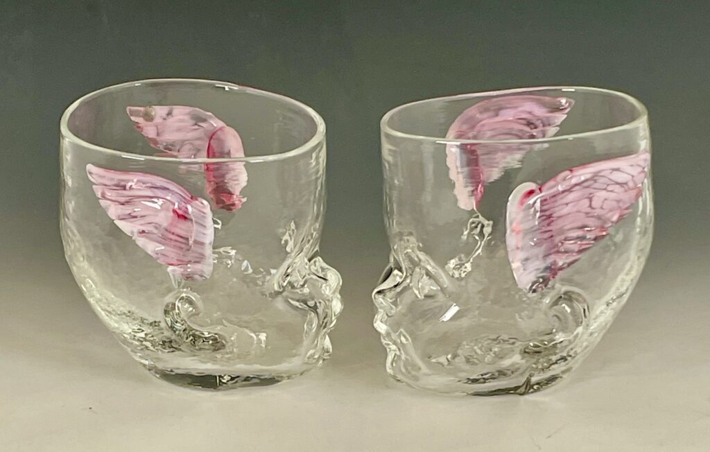Two Baby Head Cups with cherub wings facing each other