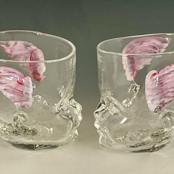 Two Baby Head Cups with cherub wings facing each other