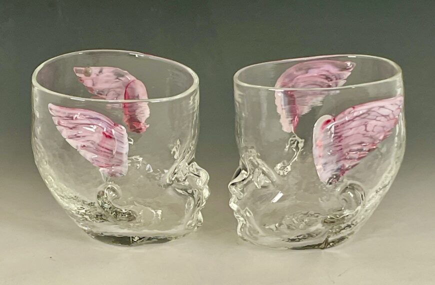 Two Baby Head Cups with cherub wings facing each other