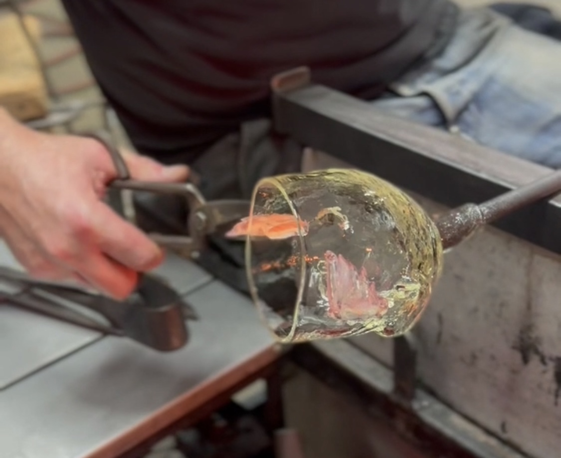 Glassblower holding a tool