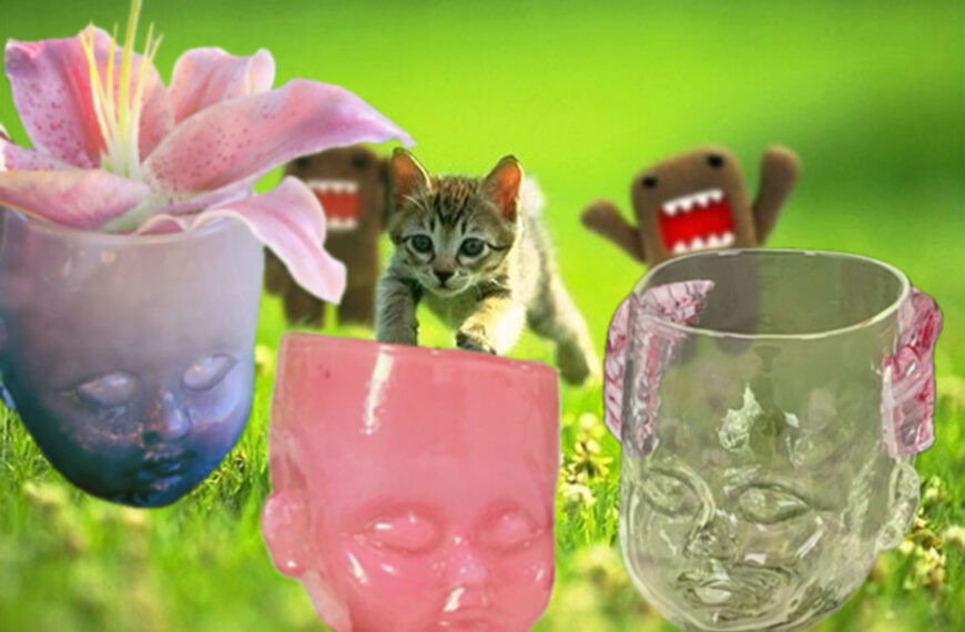 A kitten is pursued by two plushy monsters Green Meadow. Into a foreground featuring a purple, pink, and cherub Baby Head Cup.